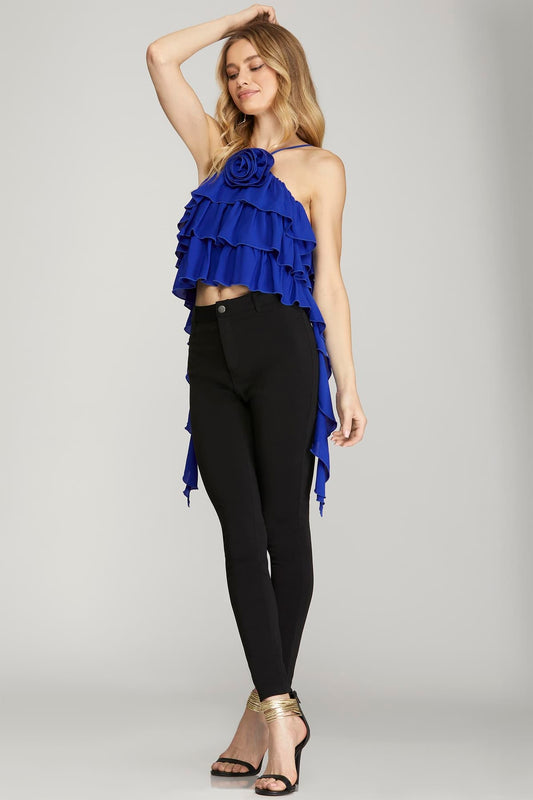 blouse features a halter neckline with ruffle