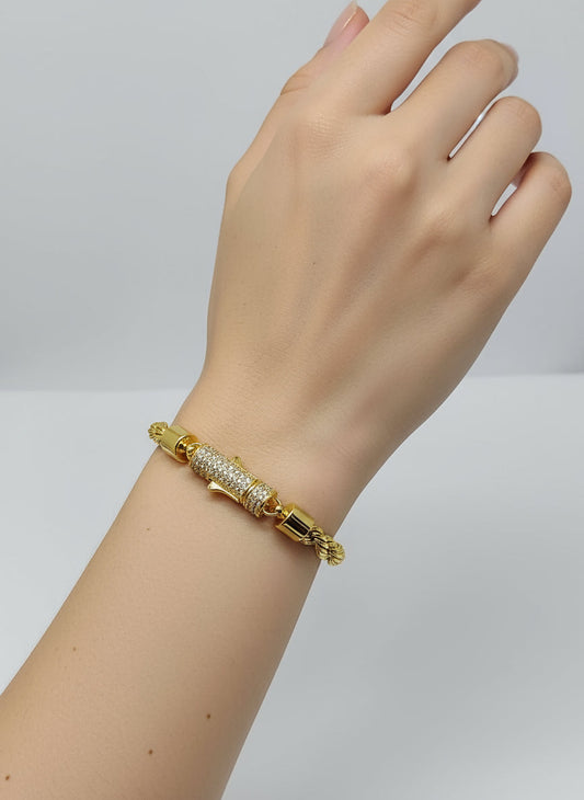 Gold bracelet with silver stone