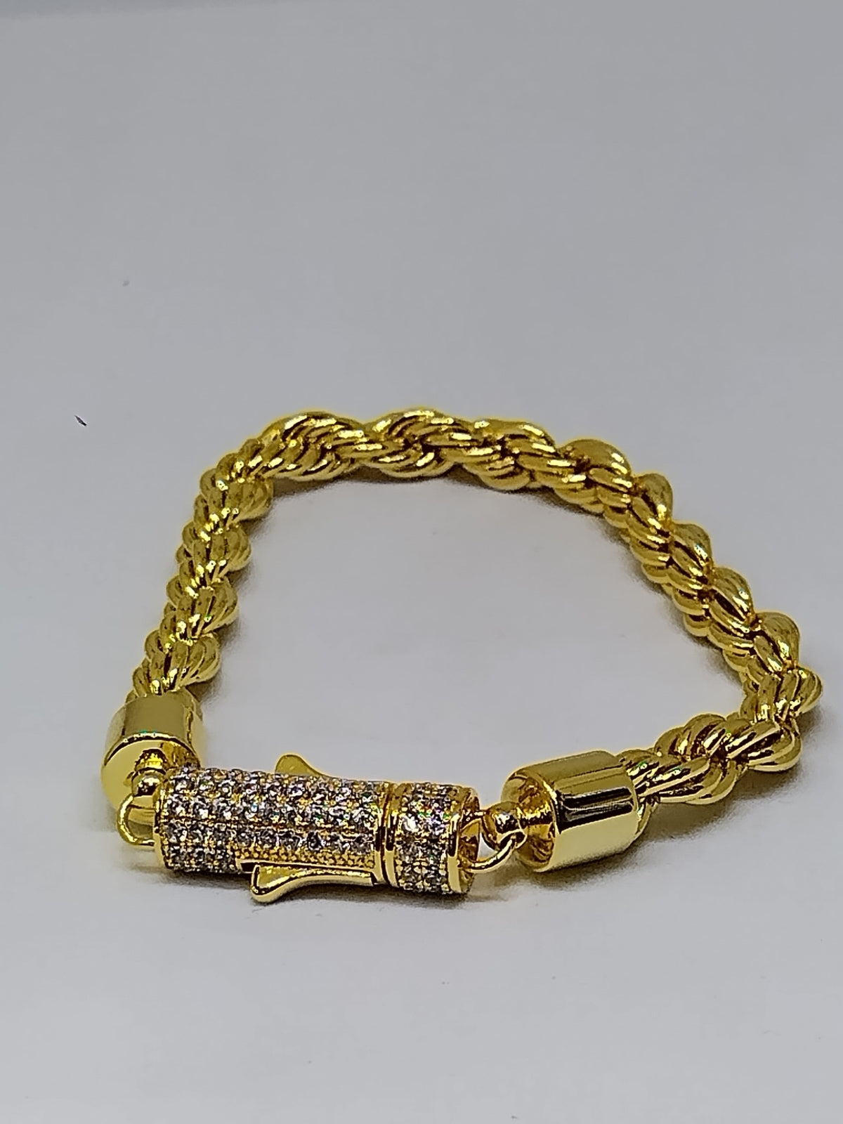 Gold bracelet with silver stone