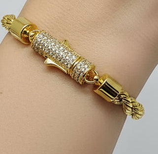 Gold bracelet with silver stone