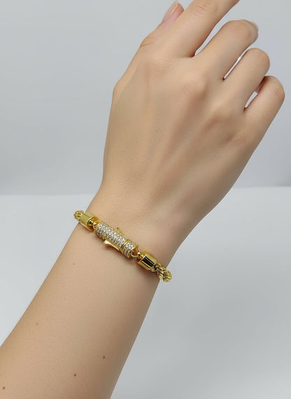 Gold bracelet with silver stone
